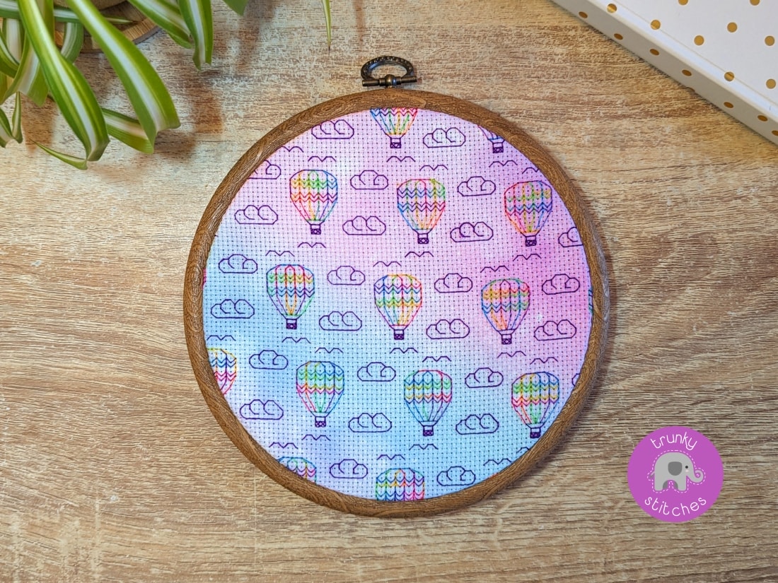 Framed blackwork embroidery piece of the Hot air balloons in the clouds blackwork pattern