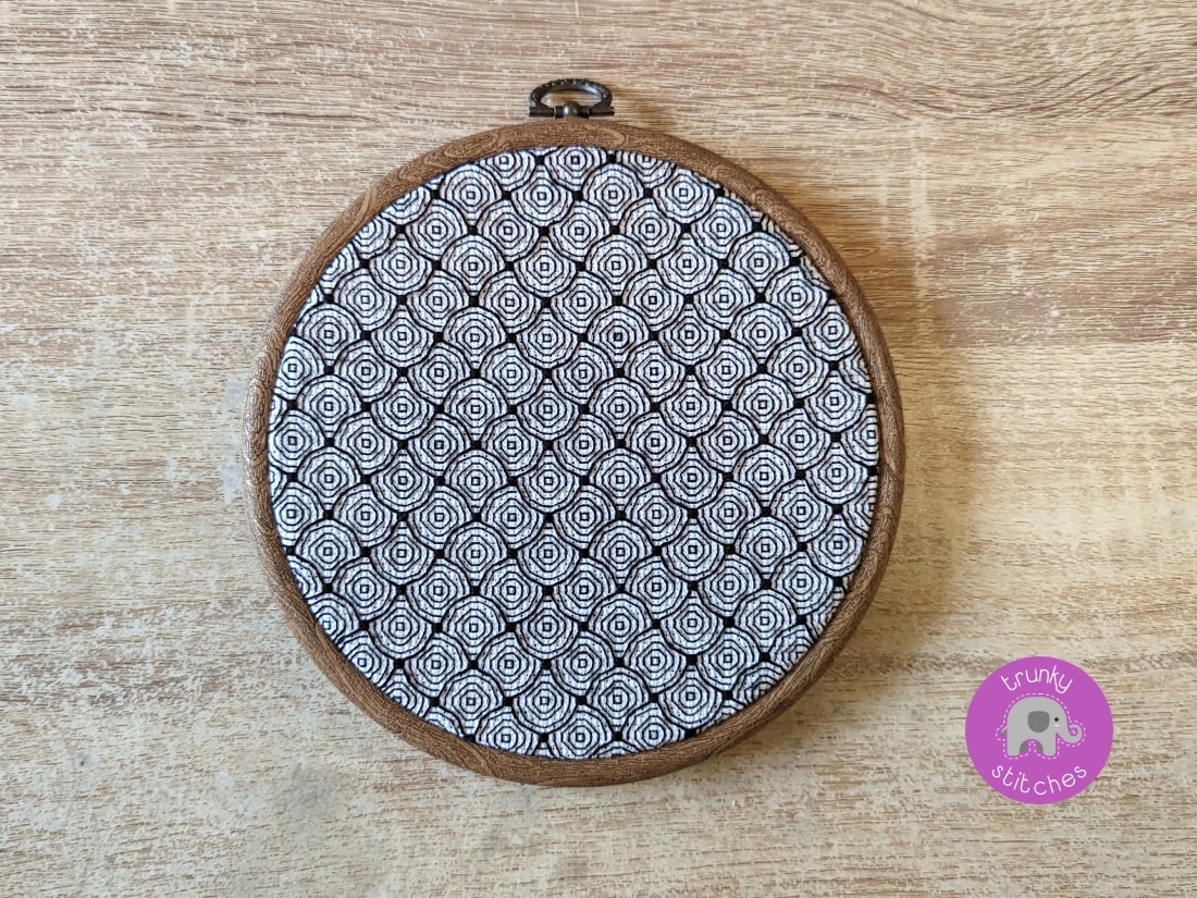 Framed blackwork embroidery piece of the Optical illusion Blackwork pattern - Circles and swirls